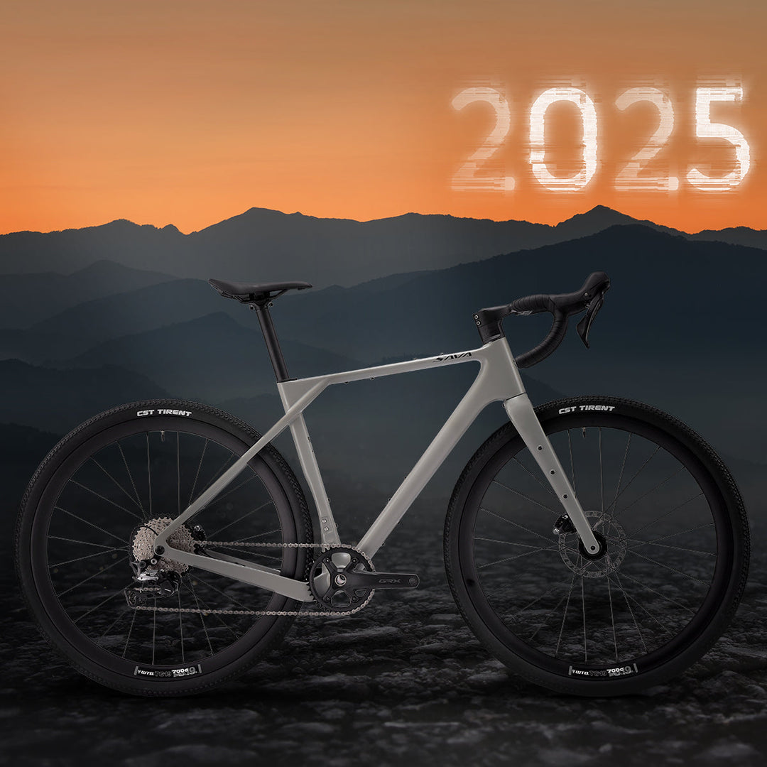 SAVA carbon road bike on rocky terrain with mountain backdrop and 2025 sunset sky