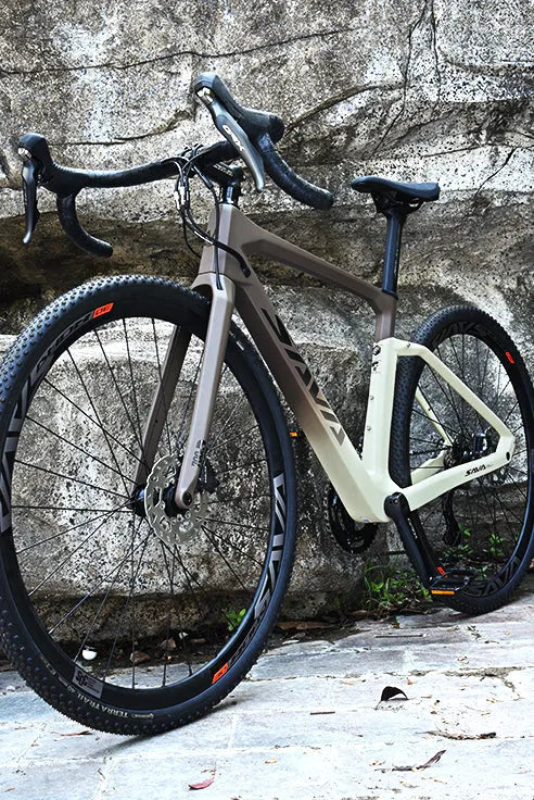 SAVA carbon road bike with lightweight frame, disc brakes, and knobby tires parked outdoors