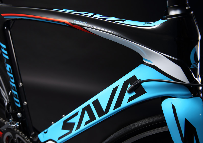 Close-up of SAVA carbon bike frame with bold blue and black design, high-speed road model