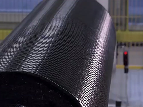 Close-up of SAVA carbon fiber material roll for innovative bike manufacturing