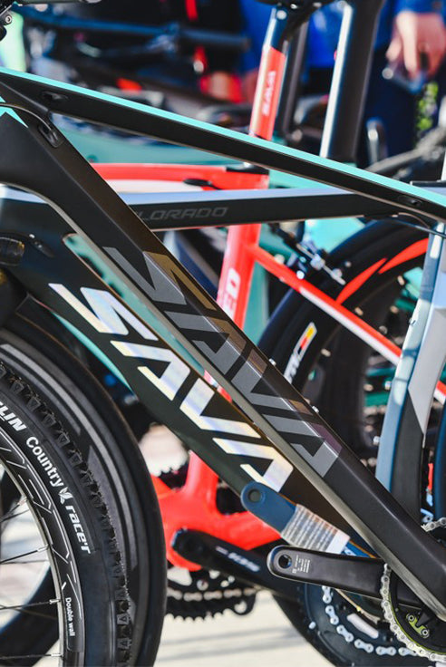 Close-up of SAVA carbon bike frame and tire, showcasing innovative design at a bike event
