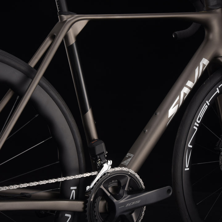 Close-up of a bicycle frame with the Sava brand logo