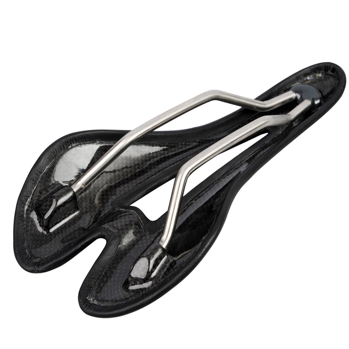 Bottom view of carbon fiber bike saddle showing hollow cutout and titanium rail structure