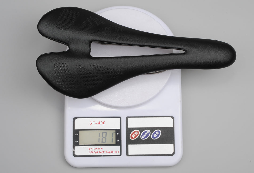 Ultralight bicycle saddle weighing 181g on digital scale, carbon fiber seat with hollow design