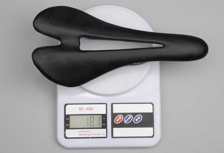 Ultralight bicycle saddle weighing 181g on digital scale, carbon fiber seat with hollow design